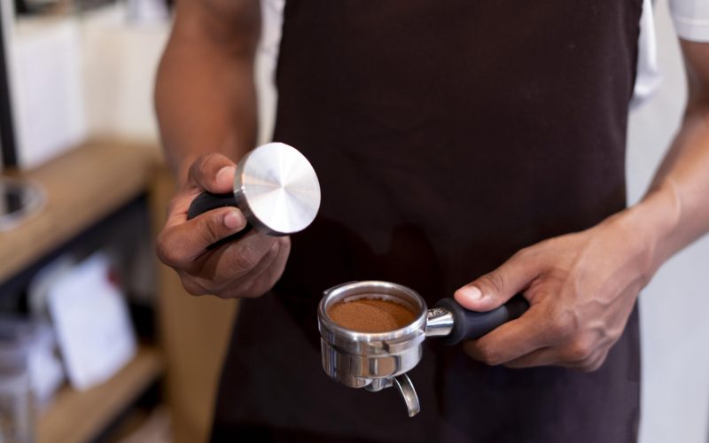 close-up-hands-preparing-coffee